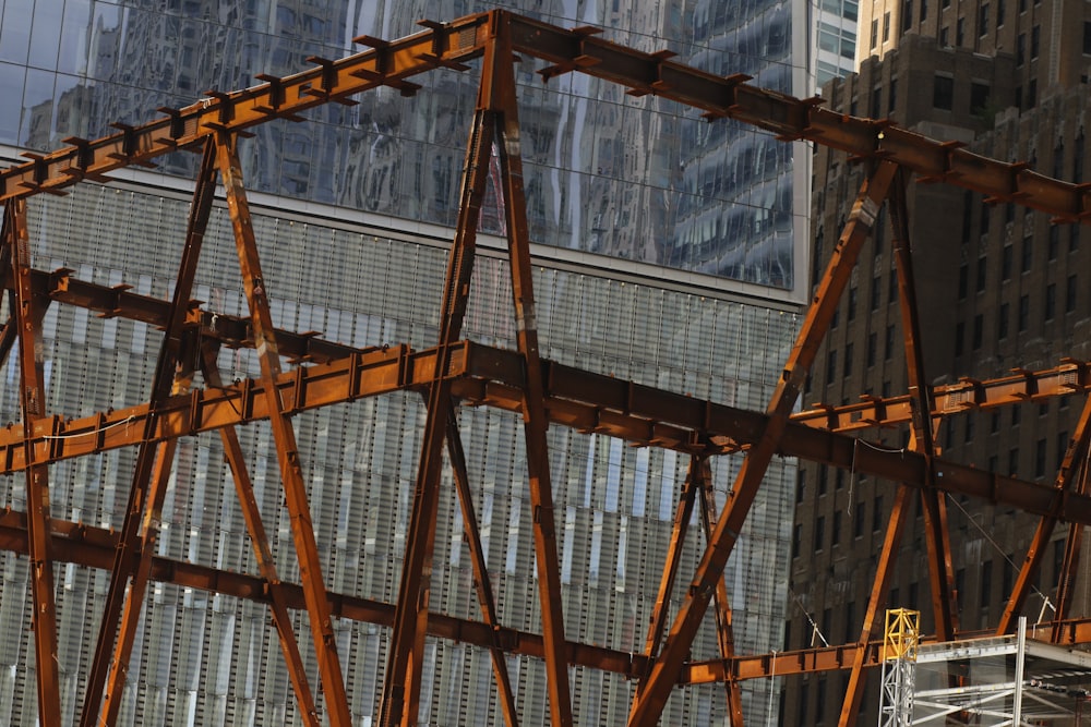 brown wooden frame near white concrete building during daytime