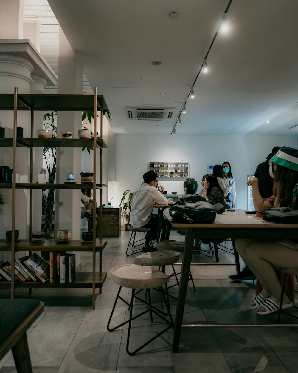 people sitting on chair in front of table