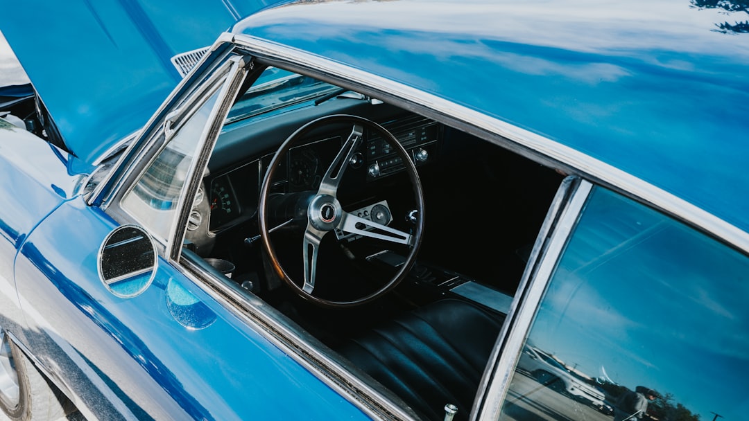 blue car with black steering wheel