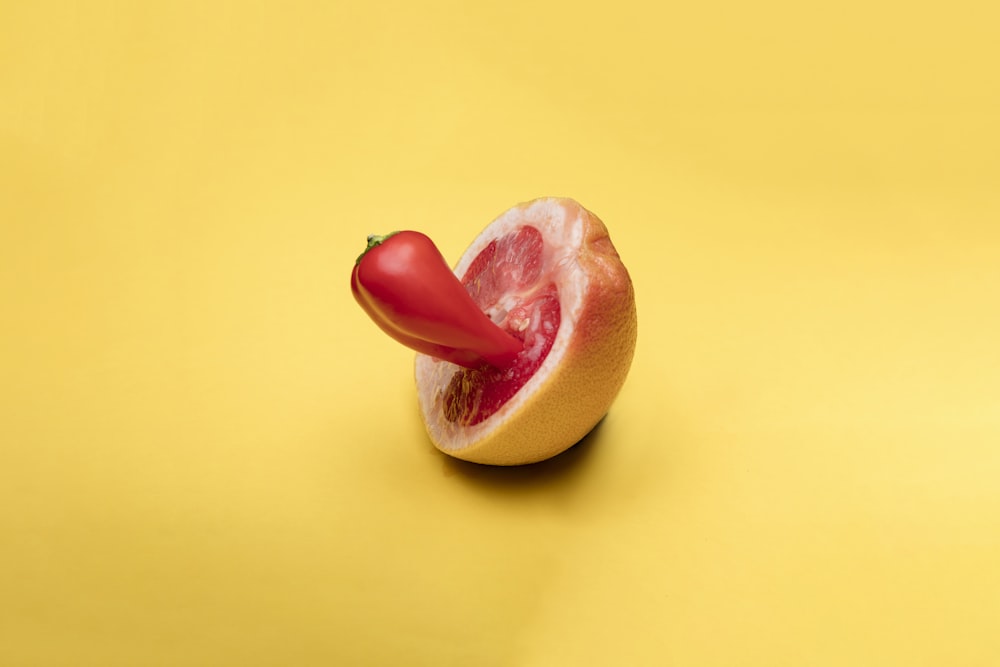 sliced apple fruit on yellow surface