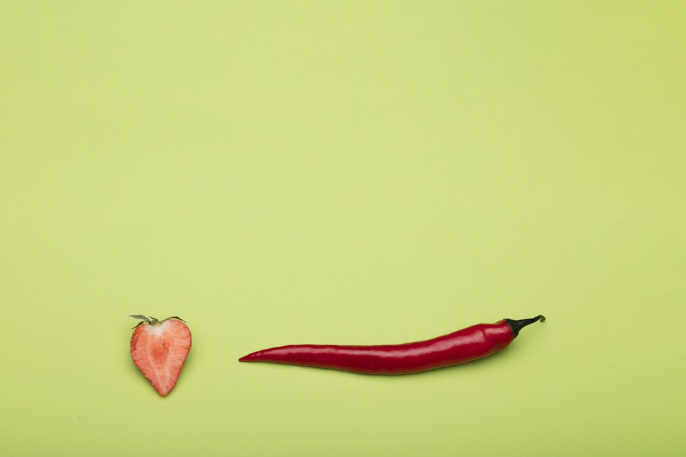 red chili on green surface