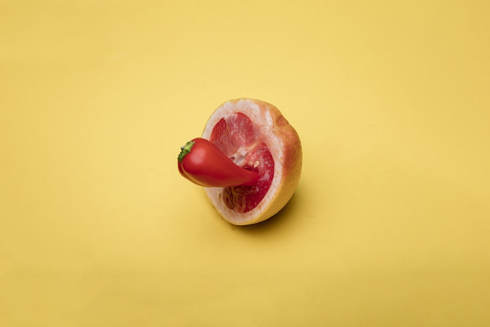 sliced apple fruit on yellow surface