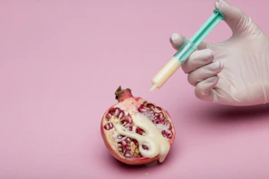 person holding green and white pen