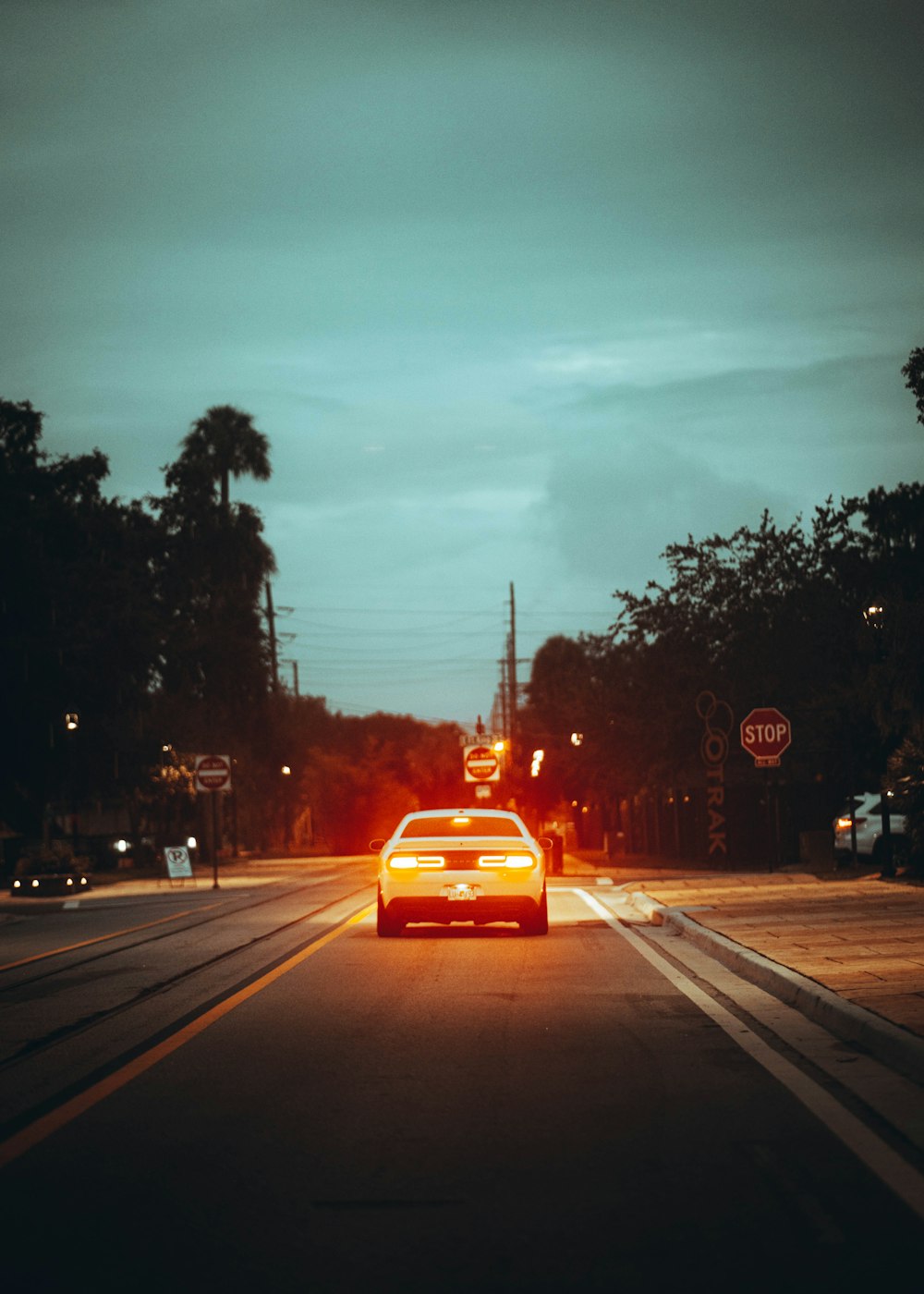 red car on road during daytime