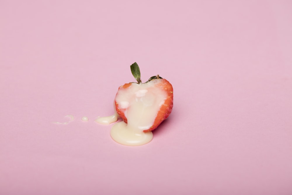 red cherry fruit on pink surface