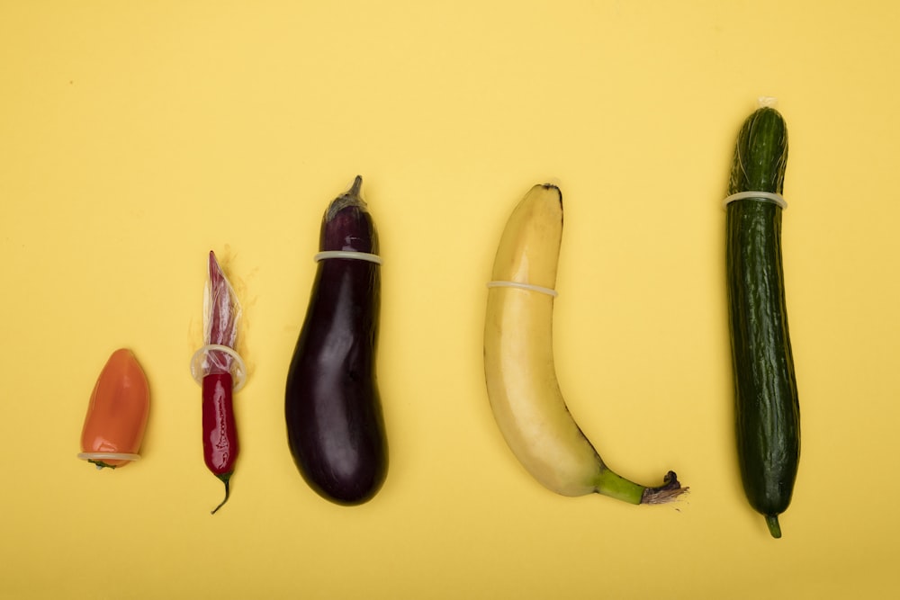 two yellow and green banana fruits