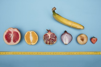 Sliced orange and whole orange fruits, symbolizing freshness, energy, and women’s sexual wellness
