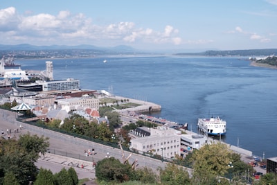 aerial view of city buildings near sea during daytime