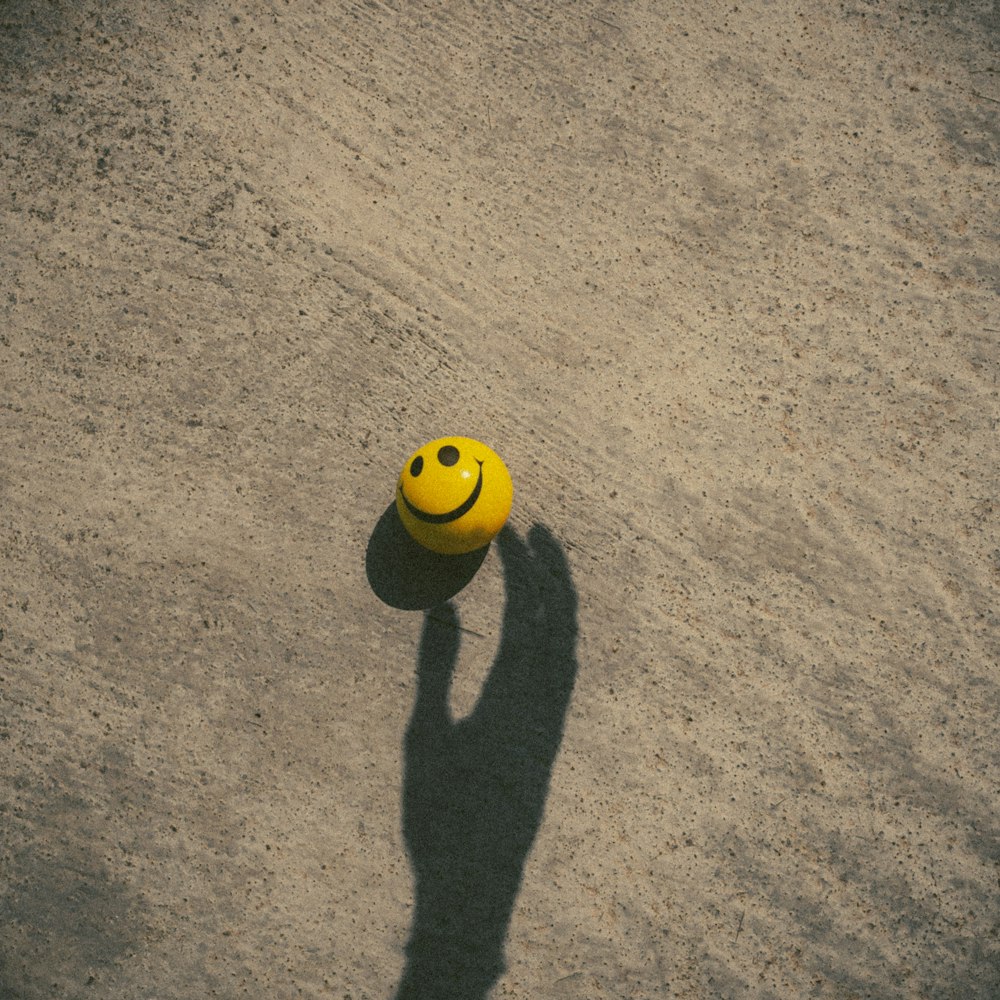 yellow and black soccer ball on brown carpet