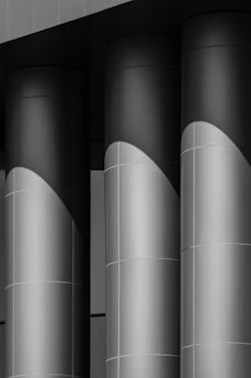 Close-up of a sleek navy and gold hexagonal column symbolizing structured tax strategy.