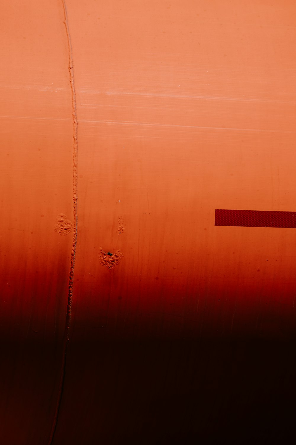 brown wooden door with red line