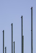 white metal pole under gray sky
