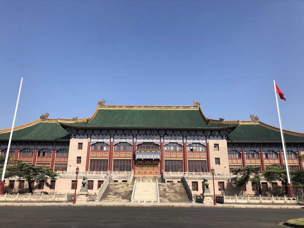 green and brown concrete building under blue sky during daytime