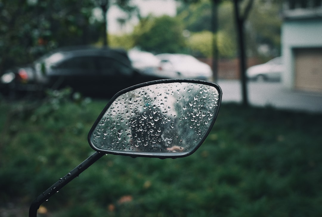 car side mirror with water droplets
