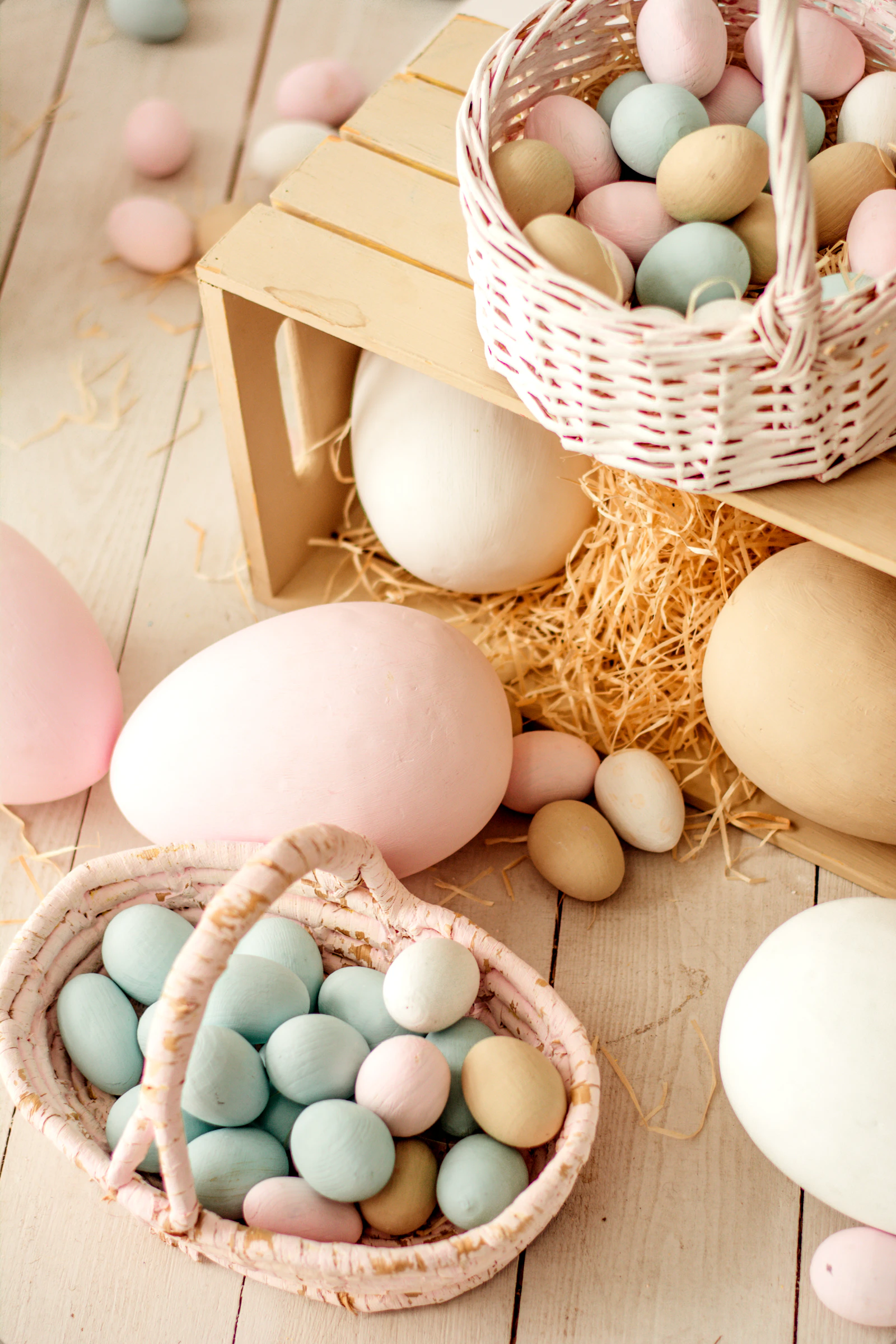 White eggs arranged in a brown woven basket