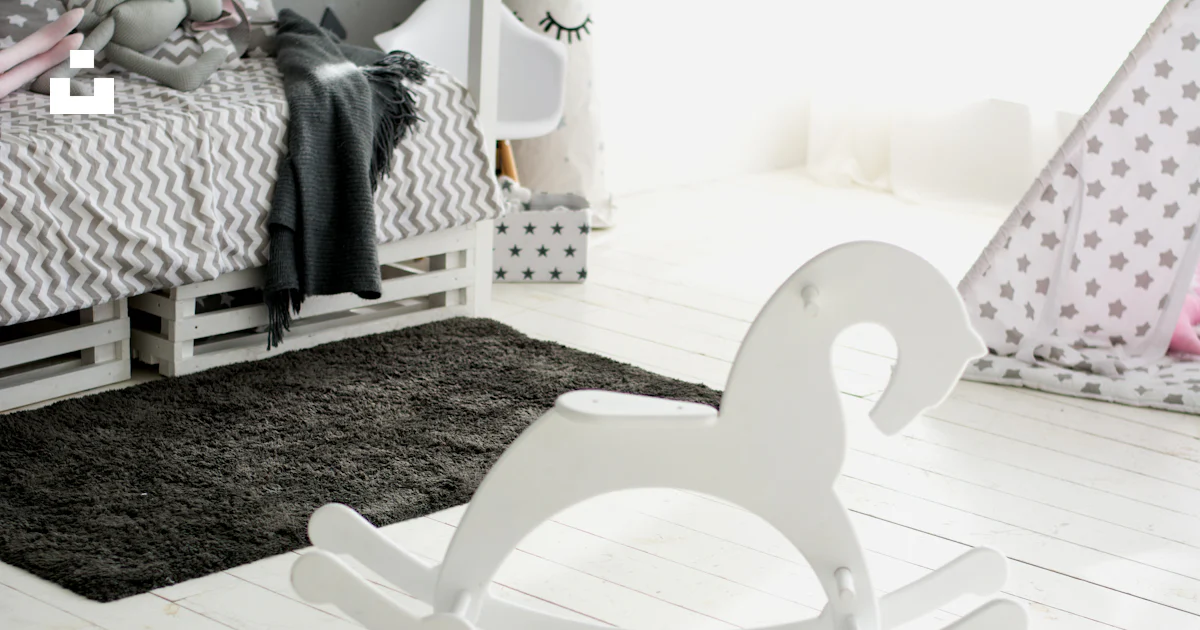 White wooden rocking chair on black and white area rug photo – Free ...
