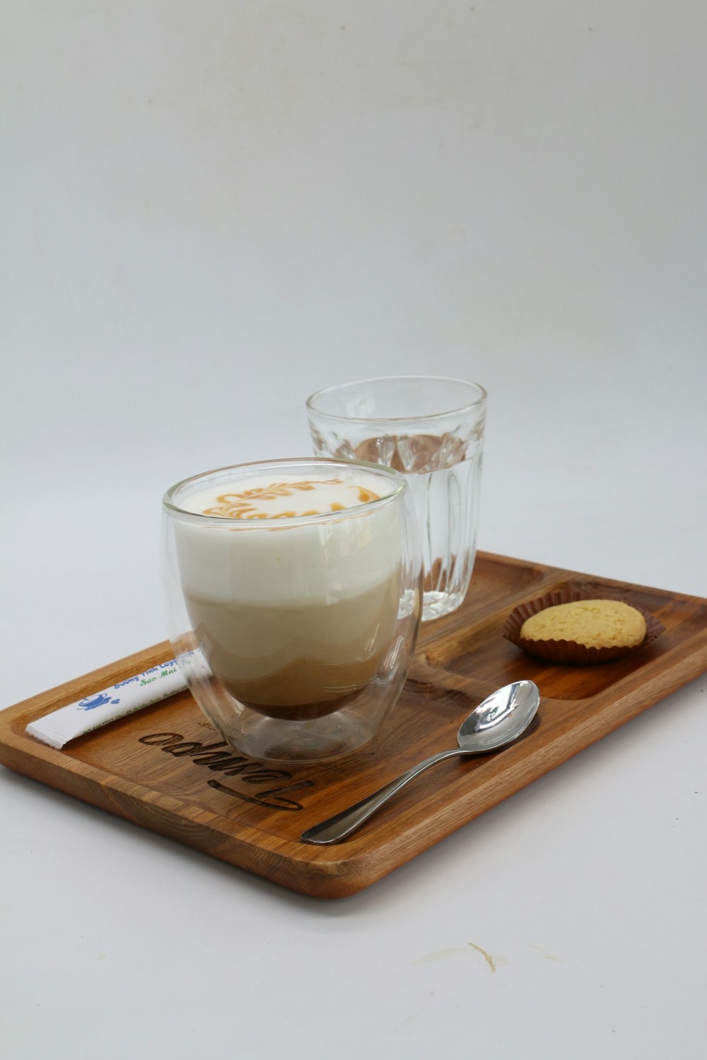 clear glass cup with brown liquid