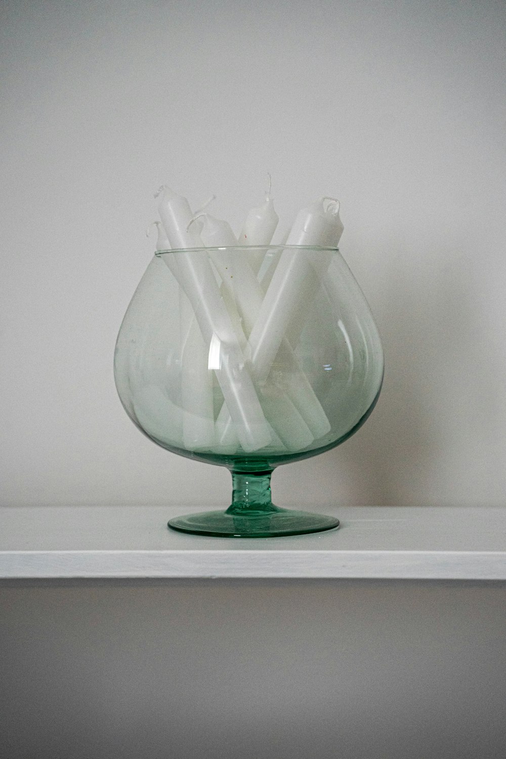 clear glass vase on white table