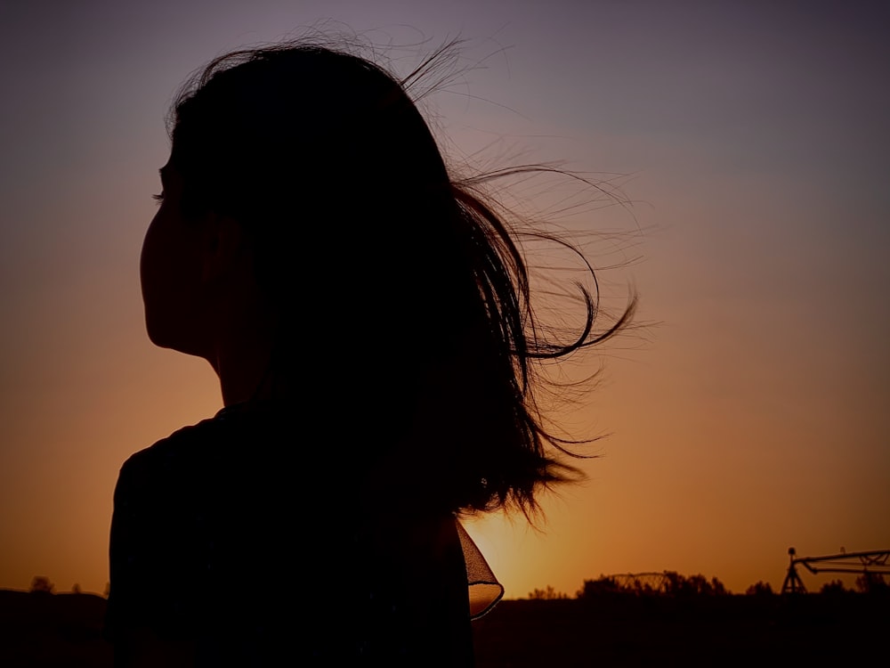 silhouette of woman during sunset