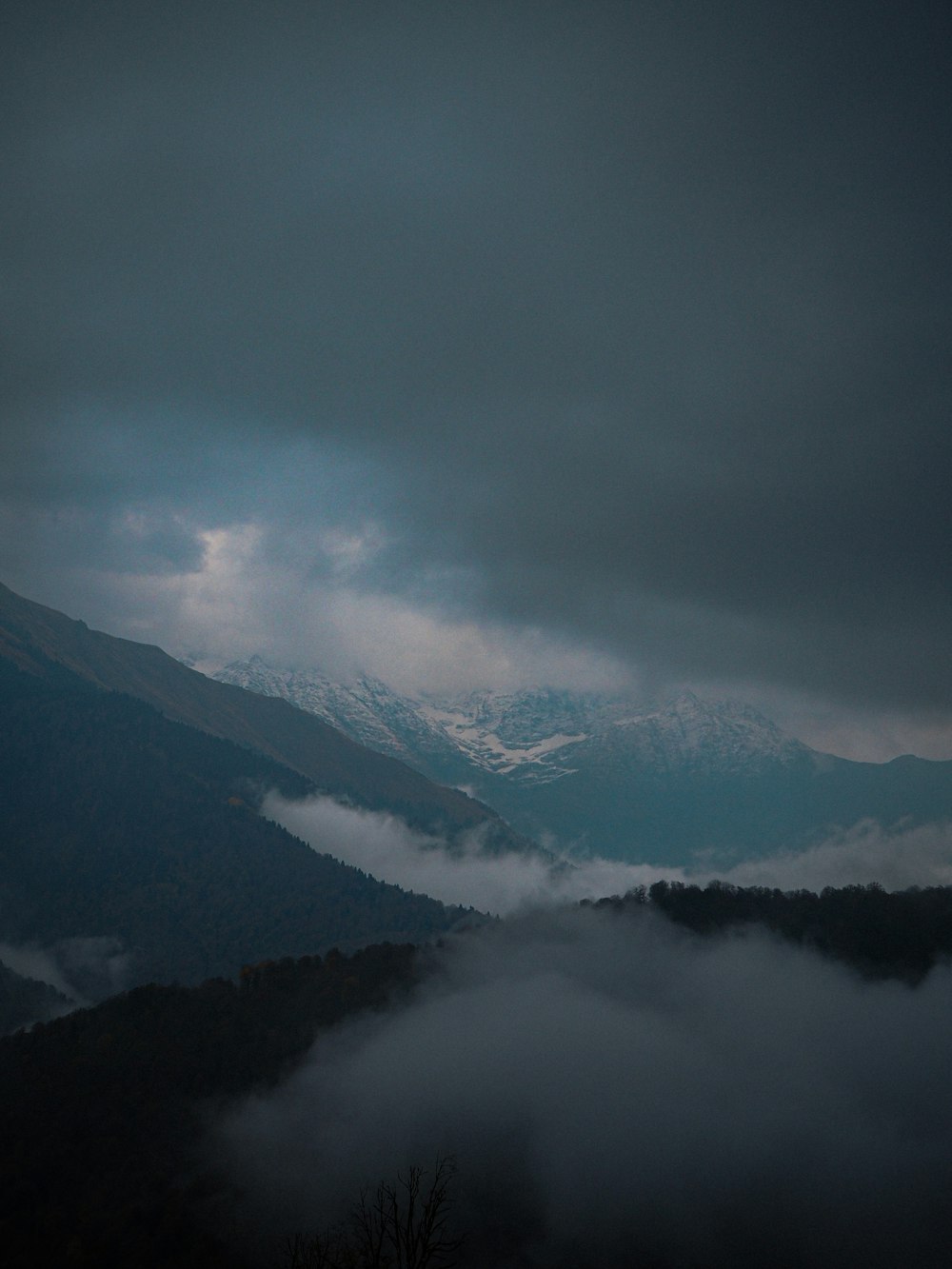 mountain range under white clouds