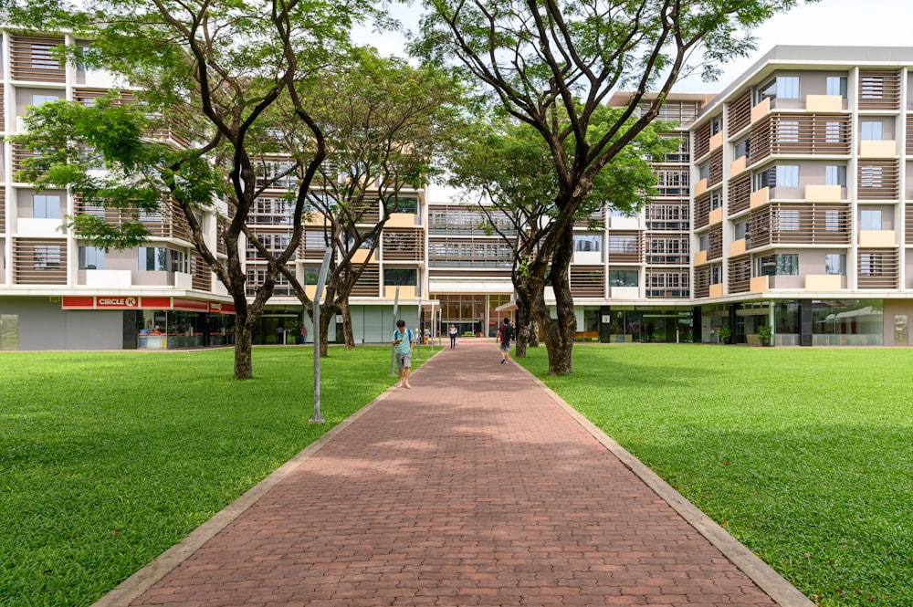 brown and white concrete building near green grass field during daytime