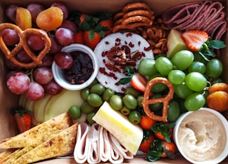 sliced vegetables and fruits on brown wicker basket