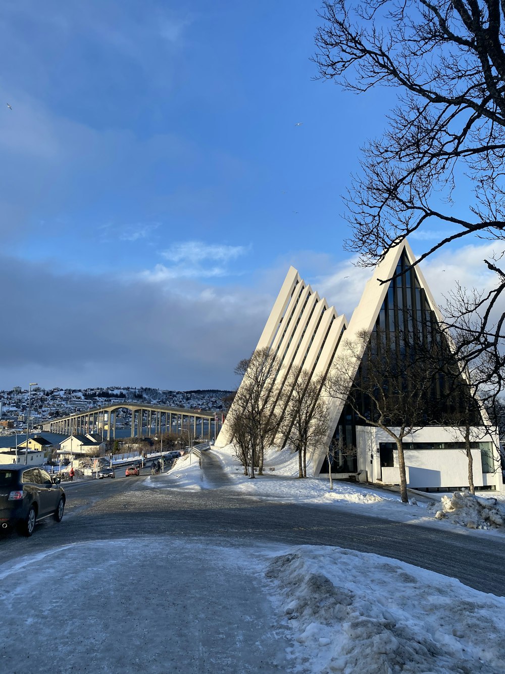 cars parked beside building during daytime