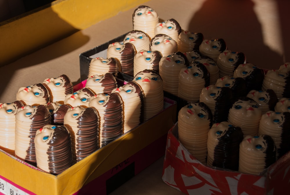 white and brown ceramic owl figurines