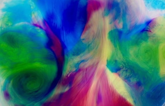 A vibrant swirl of bold, colorful abstract shapes blending seamlessly, reflecting the dynamic spirit of θεός' revealed ἀλήθεια.