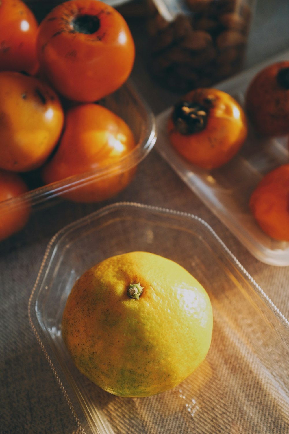 orange fruit on clear glass tray