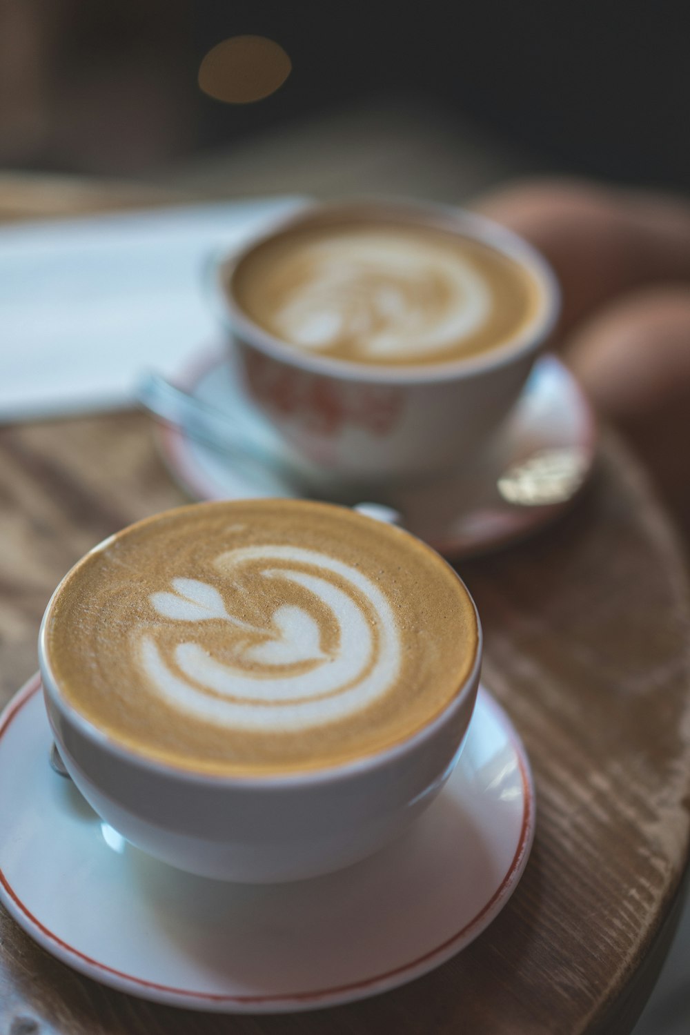 white ceramic cup with cappuccino