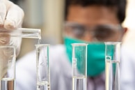 clear glass test tubes on blue plastic container