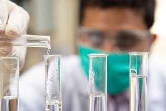clear glass test tubes on blue plastic container