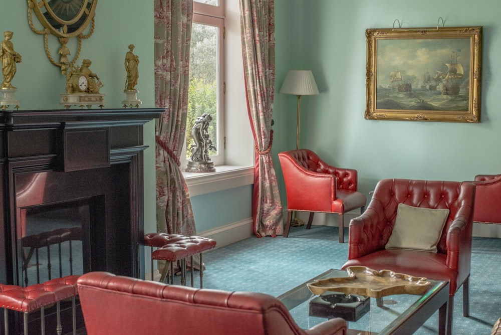 red sofa chair near fireplace