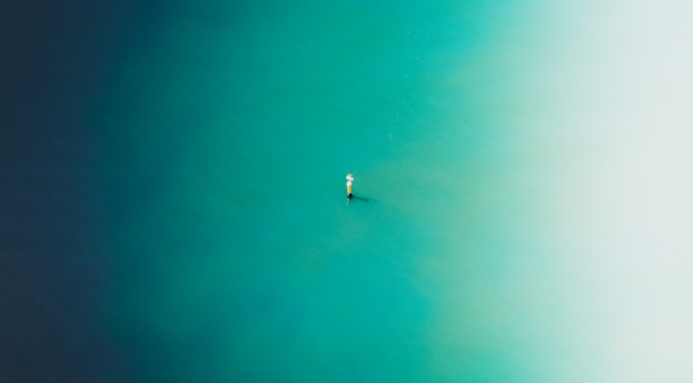 white boat on blue water