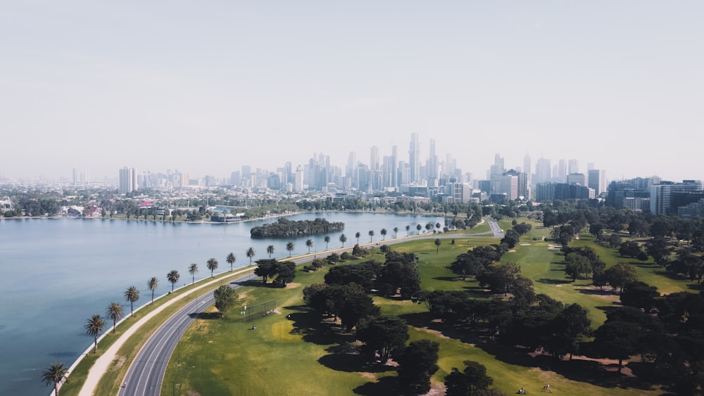 aerial view of city buildings near body of water during daytime