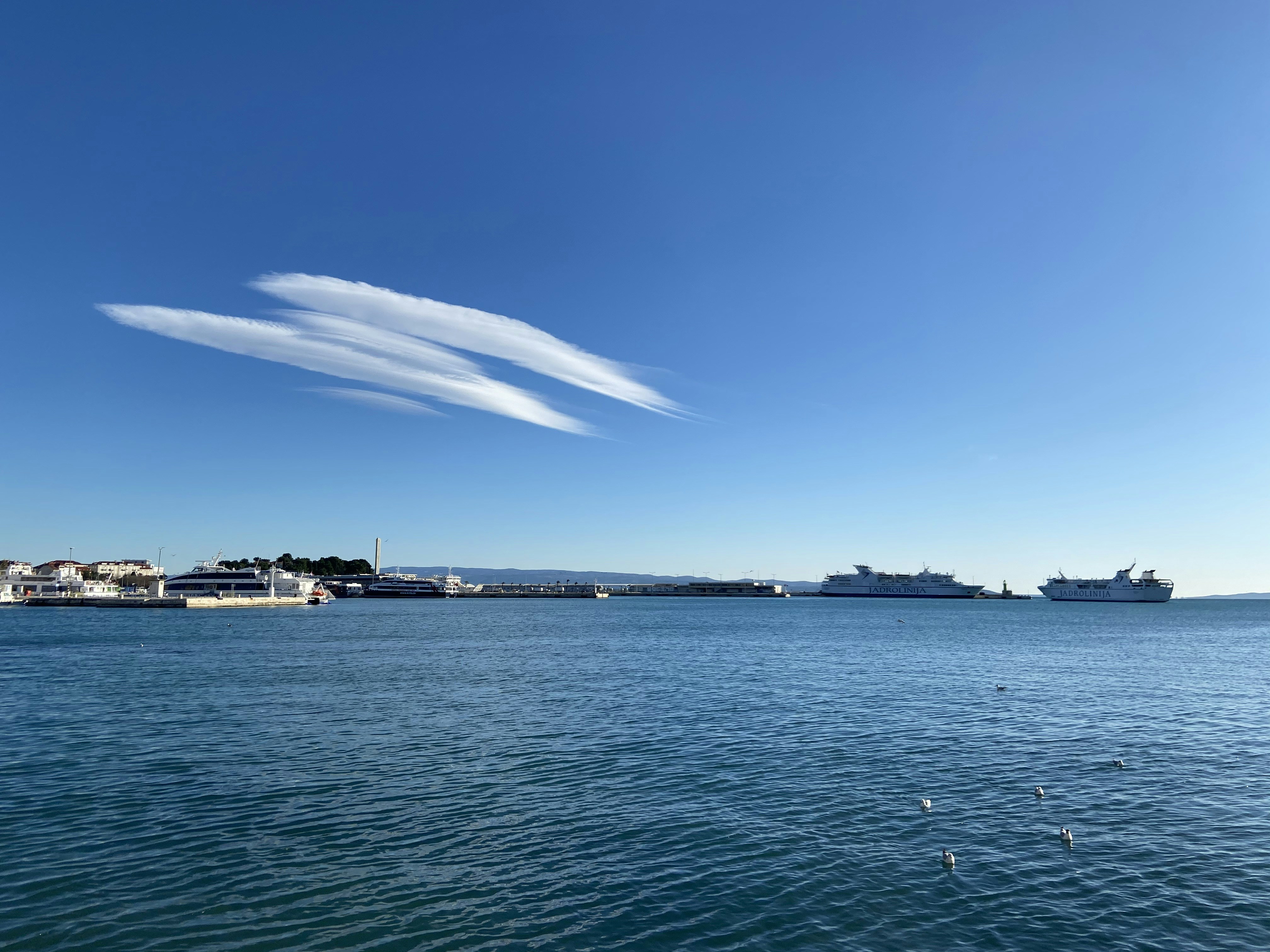 body of water under blue sky during daytime