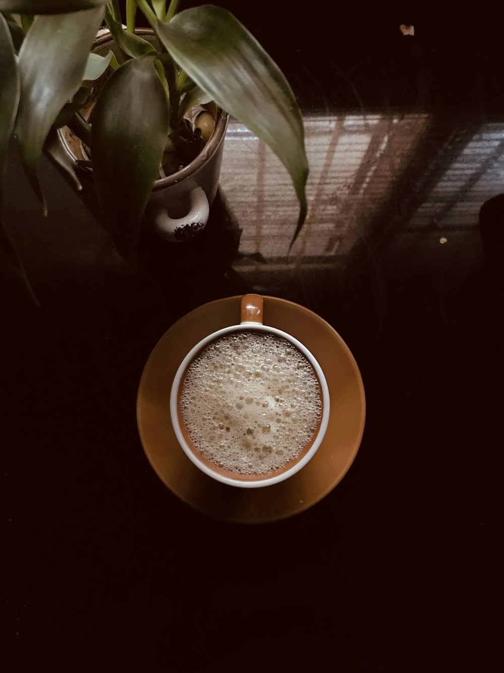 brown round plate on black table