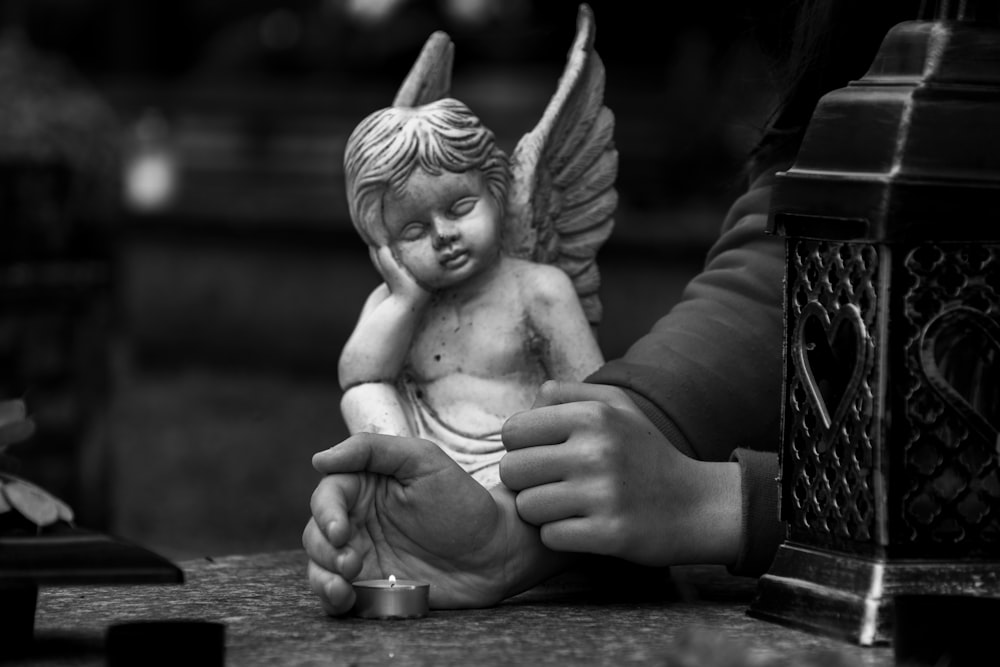 angel ceramic figurine on table
