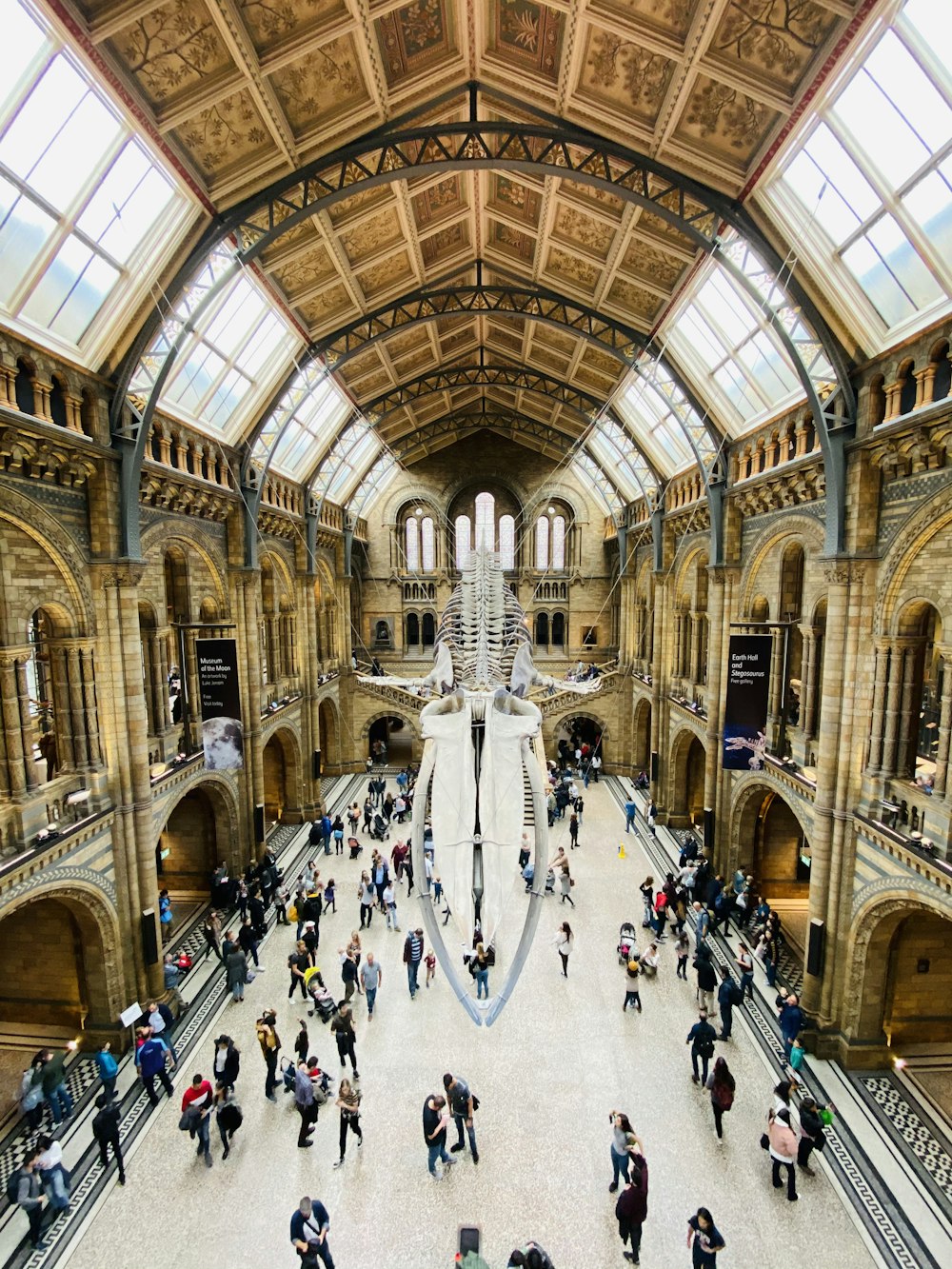 people walking inside brown building