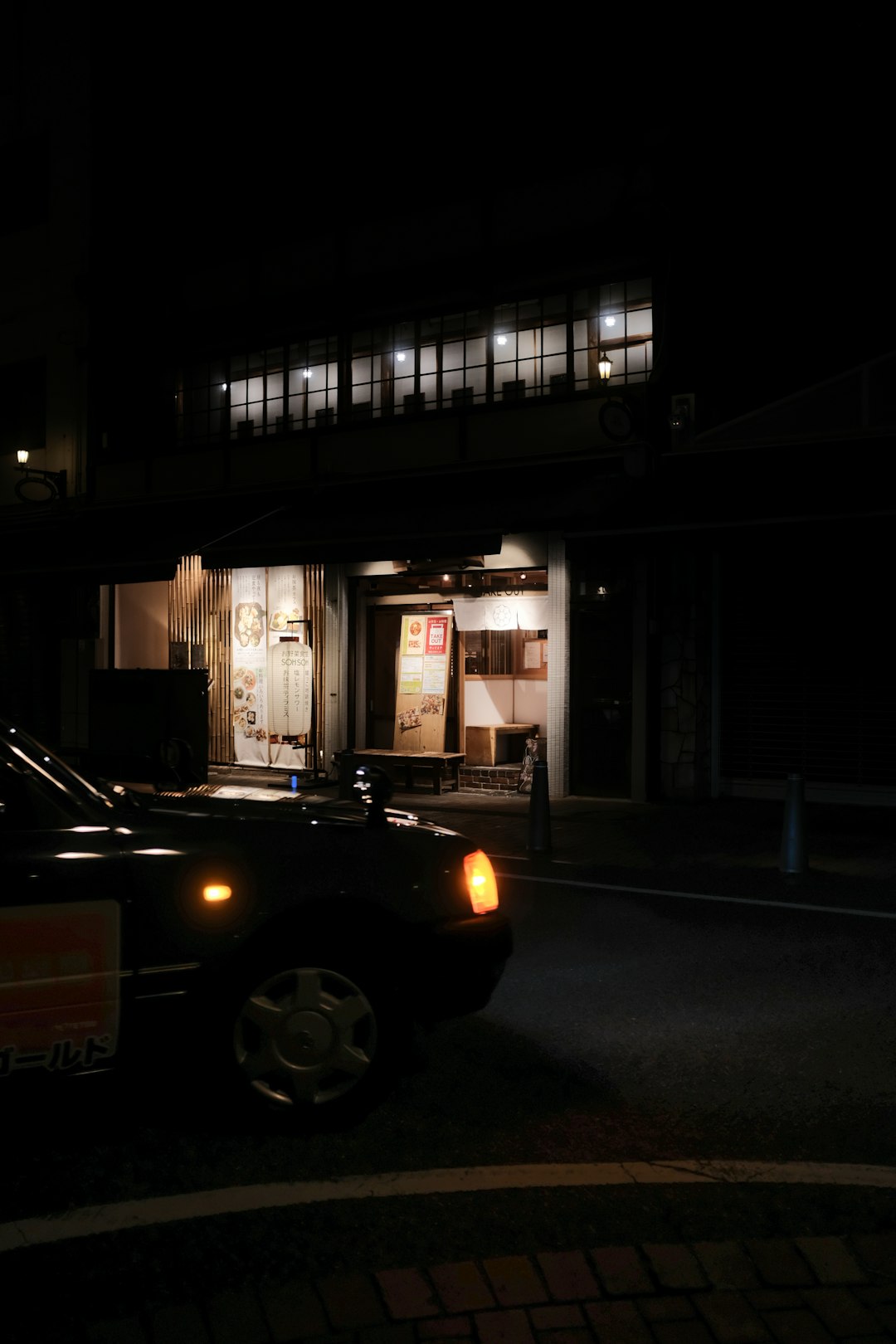 black car parked in front of building