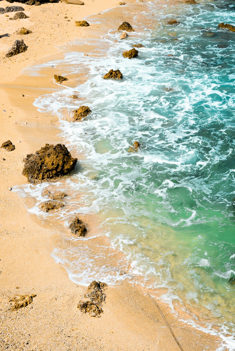 brown rock formation on seashore during daytime