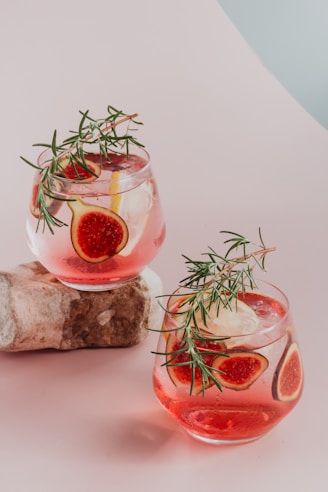 red liquid in clear drinking glass