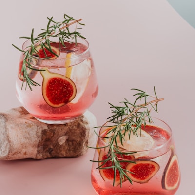 red liquid in clear drinking glass