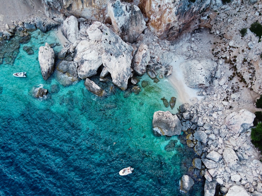 white boat on blue sea water during daytime