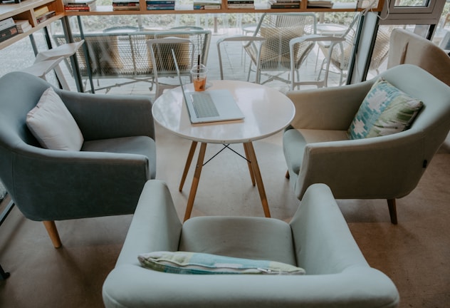 A cozy meeting area where team members collaborate over coffee.