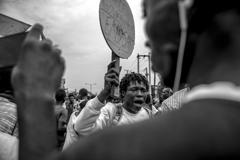 grayscale photo of people in a concert