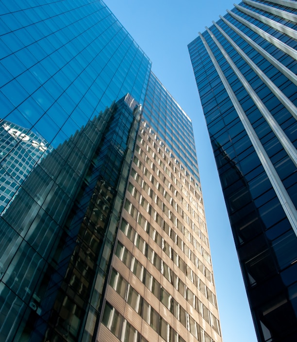 blue glass walled high rise building