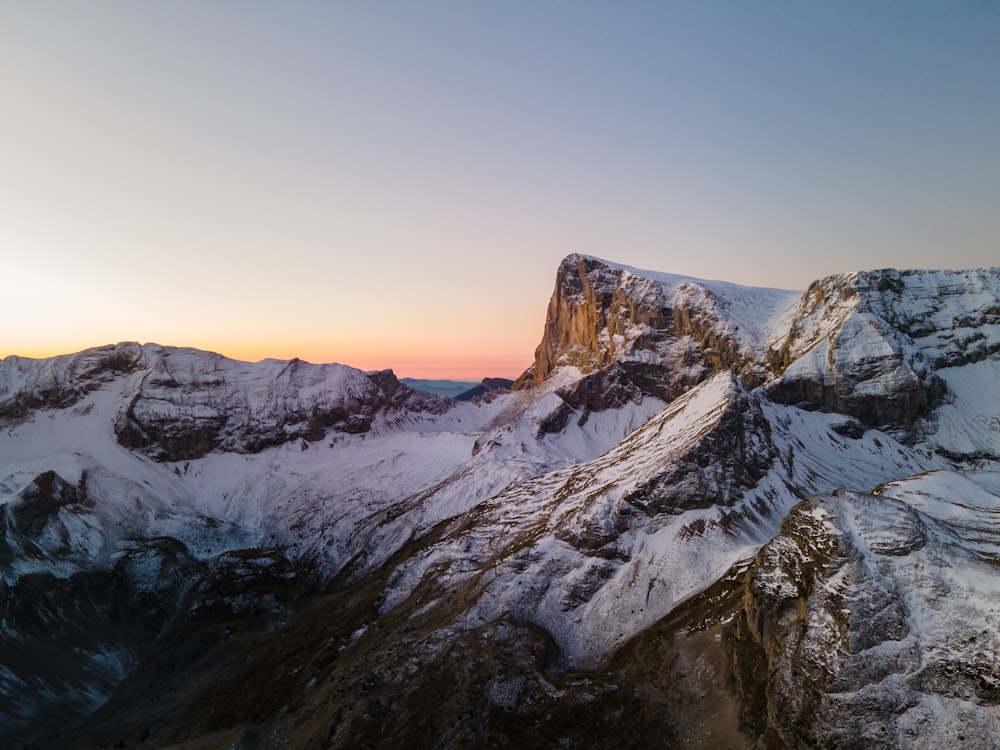 snow covered mountain during daytime