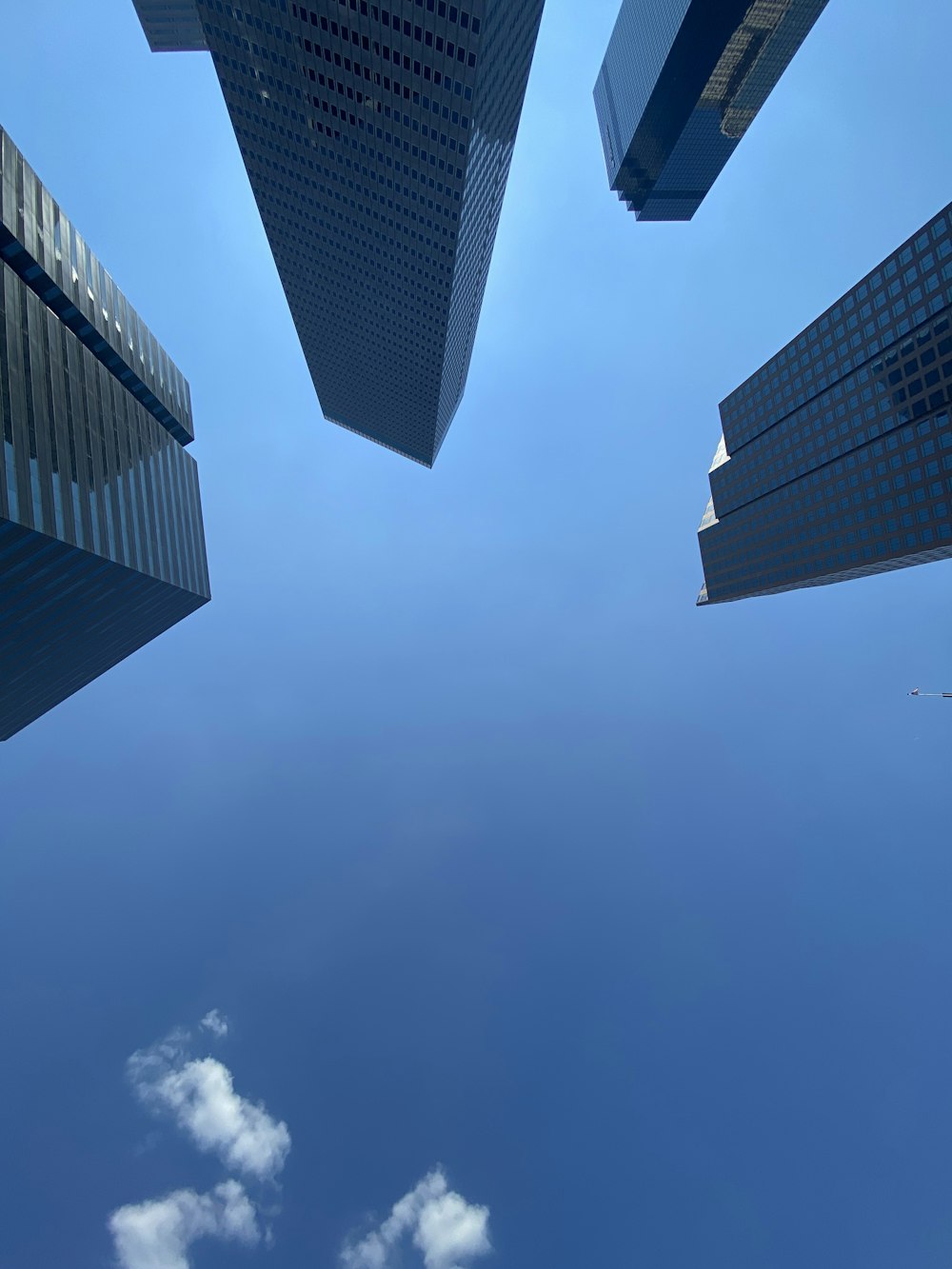 low angle photography of high rise buildings